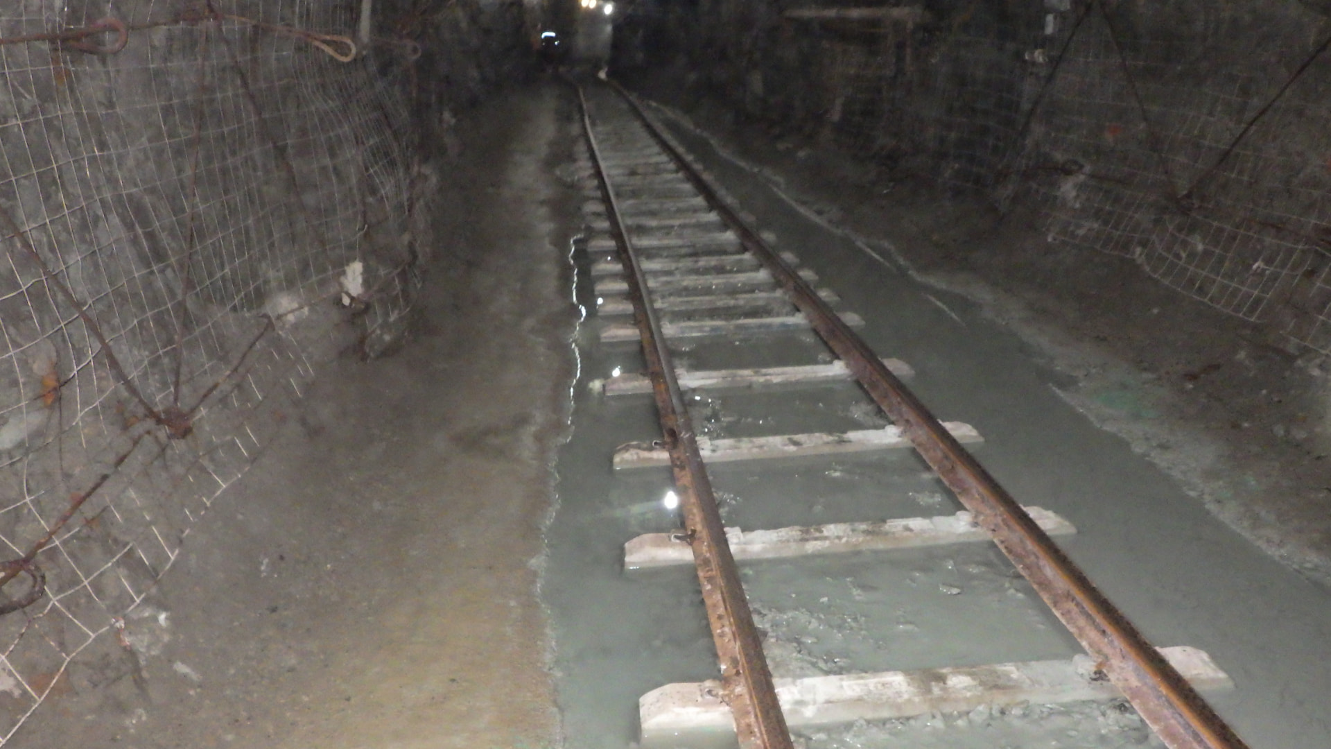 Cross Cut Management: Uncontrolled slurry runoff. Haulage track bed under water, where constant flow was breaking down the track foundation and stopping tramming.