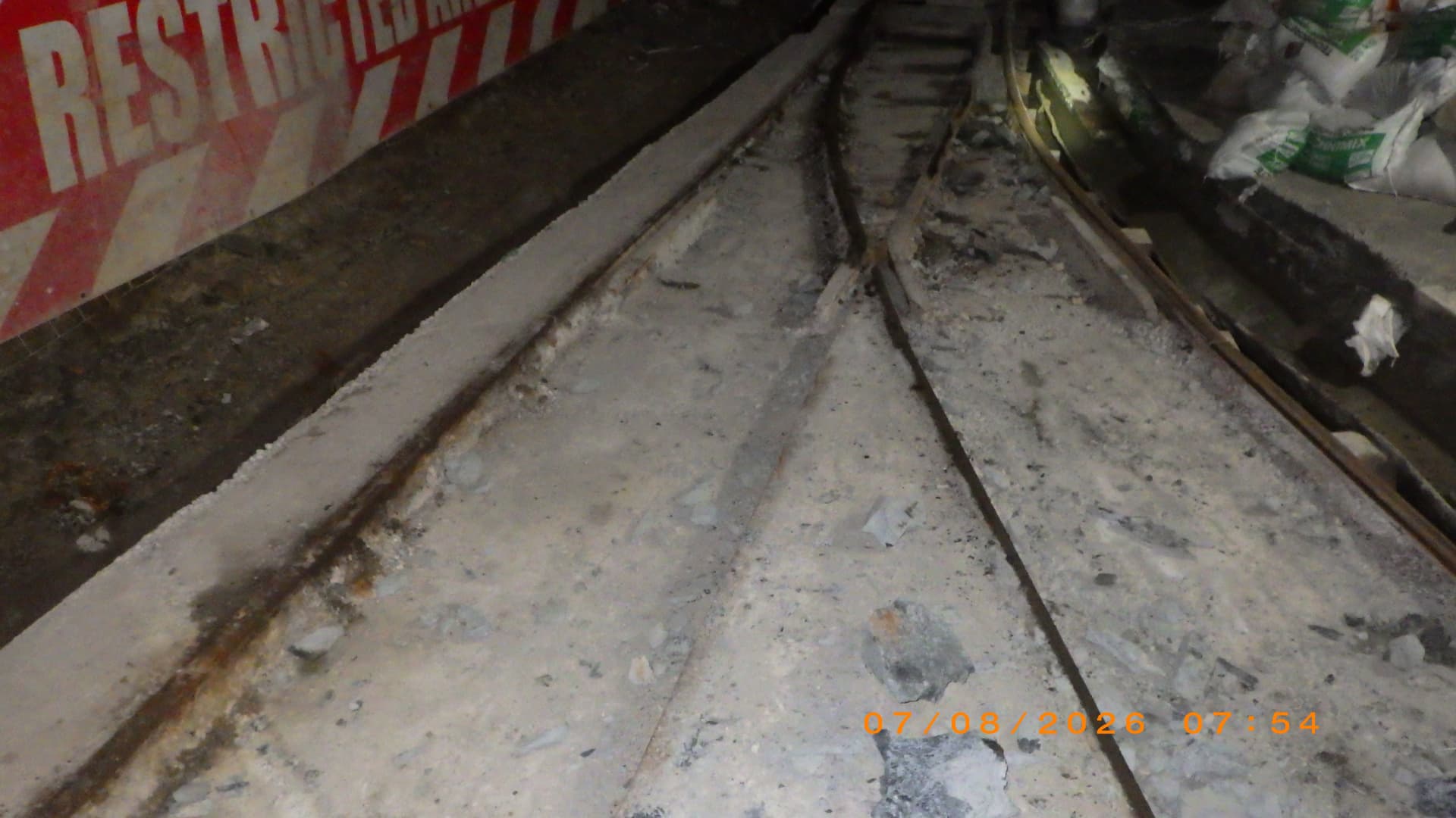 Cross Cut Management: Concreted rail switch. Rail switch and turnout set in concrete to hold alignment and prevent derailments where they usually start.